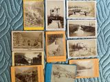 a lot of old postcards that are on the bed