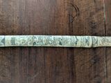 an old baseball bat that is on a wooden floor