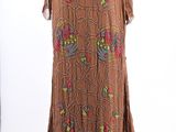 a woman ' s brown dress on a mannequin mannequin mannequin mannequin mannequin mannequin mannequin mannequin