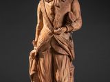 an image of a statue of a man holding a dog
