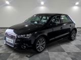 an image of a black audi suv parked in a garage