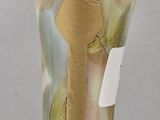 a glass vase with a gold and green design on it
