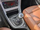 an image of a car ' s gear lever in the center console