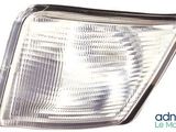 a close up of a headlight of a car on a white background
