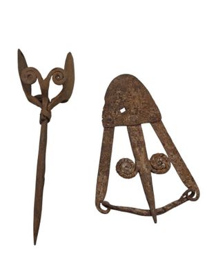 pair of old rusty garden tools on a white background