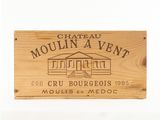 a close up of a wooden sign with a building on it