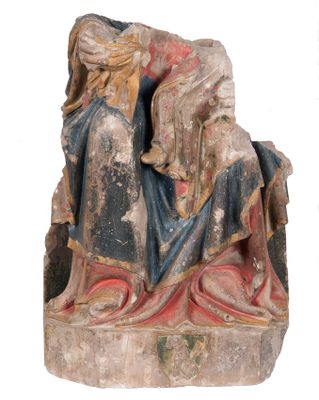 an old statue of a woman with a child on her lap
