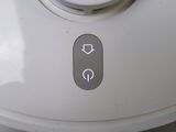 a close up of a button on the side of a toilet