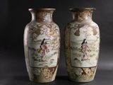two vases that are sitting side by side on a black background