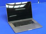 a laptop computer sitting on a blue table