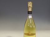 a bottle of wine that is sitting on a table