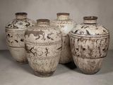 four vases that are sitting on a table