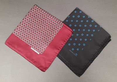 two different colors of handkerchiefs on a table with a gray background