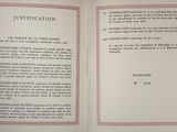 an open book with a pink border on it