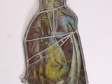 a picture of a religious figurine hanging on a wall