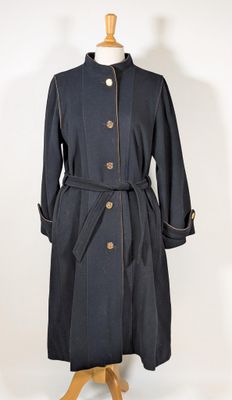 an image of a black coat on a mannequin stand