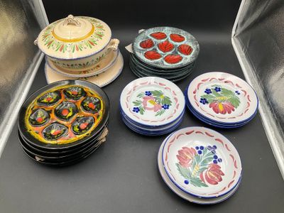 a lot of plates and bowls on the counter
