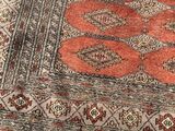 an image of a rug with a snake design on it