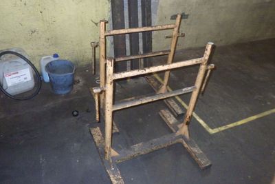 a wooden ladder that is sitting in a garage