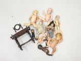 a lot of dolls that are sitting on a table