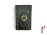 an old green book with a gold emblem on the cover