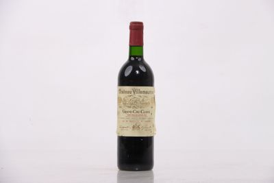 a bottle of wine that is sitting on a table