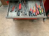 a lot of tools in the drawer of a tool box