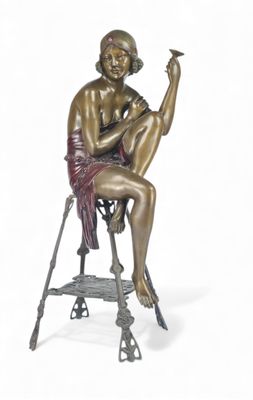 bronze statue of a woman sitting on a stool with a cigarette in her hand