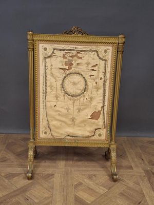 a gold frame with a map on it sitting on a wooden floor