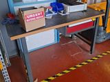 a workbench with a box on it in a garage