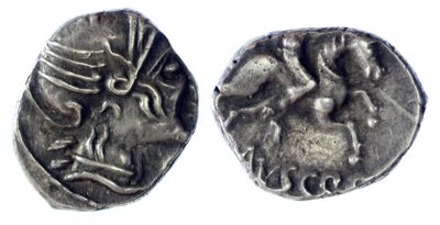 a silver coin with an image of a woman and a man on it