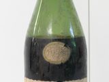 a bottle of wine that is sitting on a table