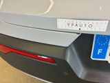 a close up of a car ' s rear bumper with a sticker on it