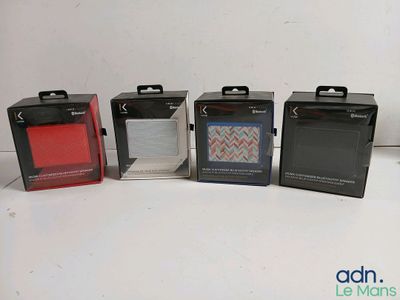 four boxes of different colors and sizes of items on a white surface