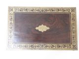 a wooden box with a decorative design on it