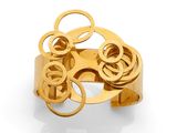 a close up of a gold ring on a white surface