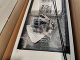 a box with a picture in it and a pair of chopsticks in it