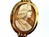 an image of a picture of a woman in a gold frame on a stick