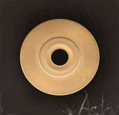 a picture of a black and white photo of a gold plate