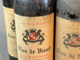 several bottles of wine are lined up on a table