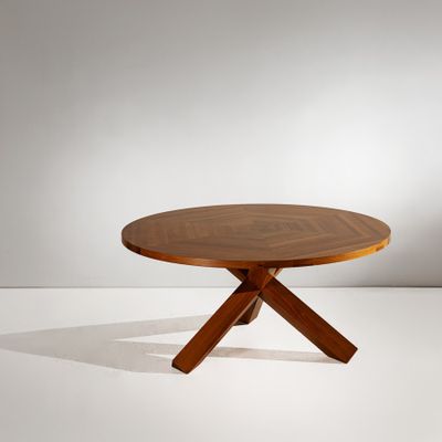an image of a wooden table with two crossed legs