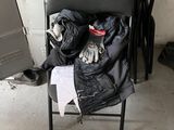 a cat sitting on top of a chair in a room