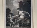 an old picture of a woman holding a child in her lap