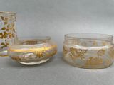 two cups and a saucer sitting on a table