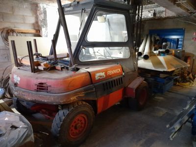 an image of a construction vehicle in a garage