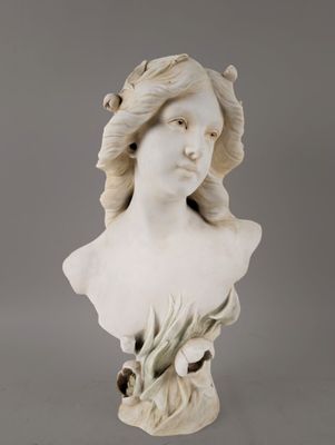 a white busturine of a woman with long hair and a flower in her hair