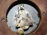 a close up of a clock that is on a table