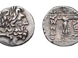 an ancient coin with a picture of a woman and a man on it