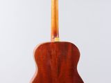 a close up of a guitar on a white background
