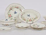 many pieces of china on display on the table